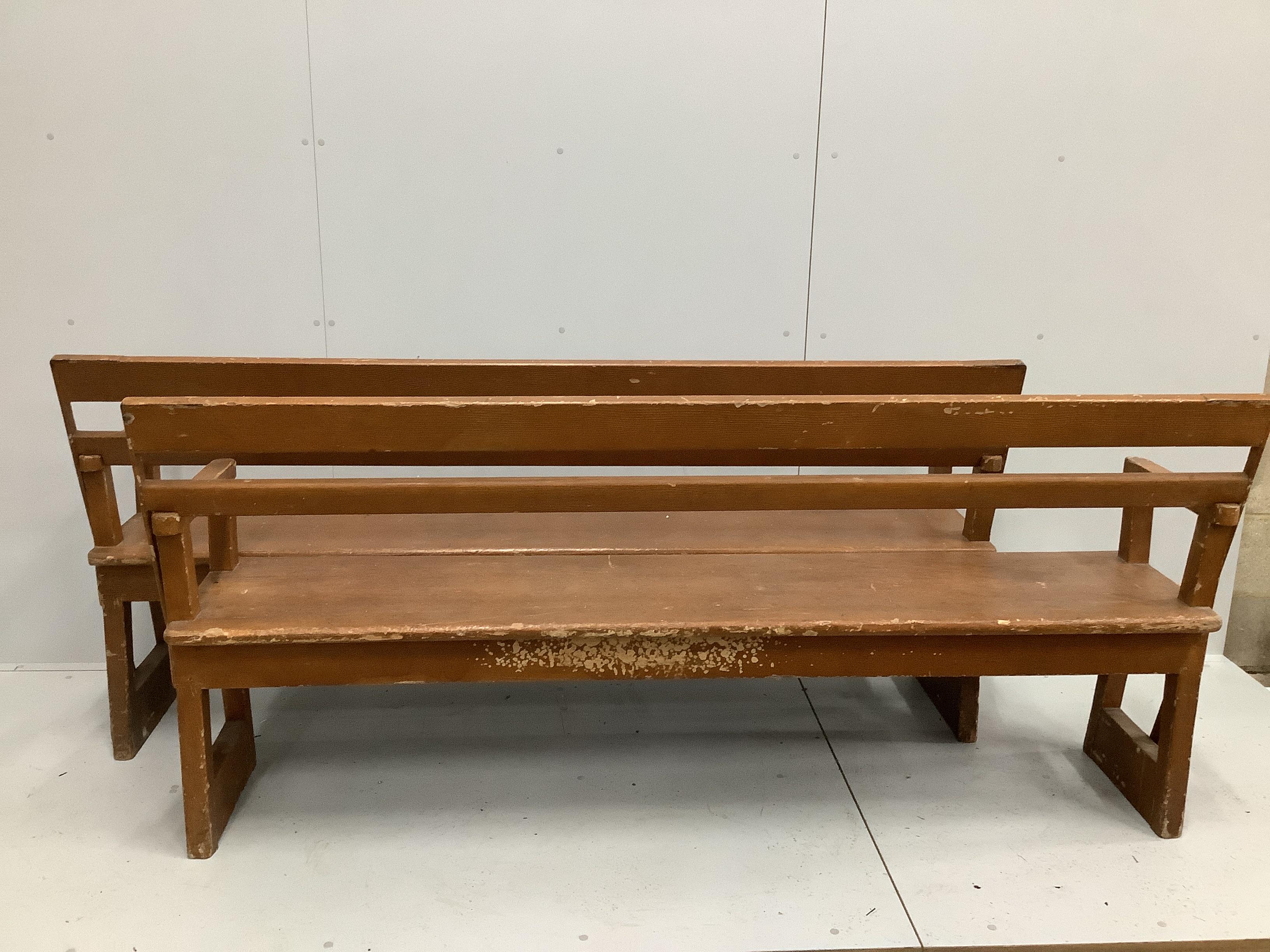 A pair of late 19th century Continental painted pine station benches with hinged adjustable backs, length 200cm, depth 41cm, height 91cm